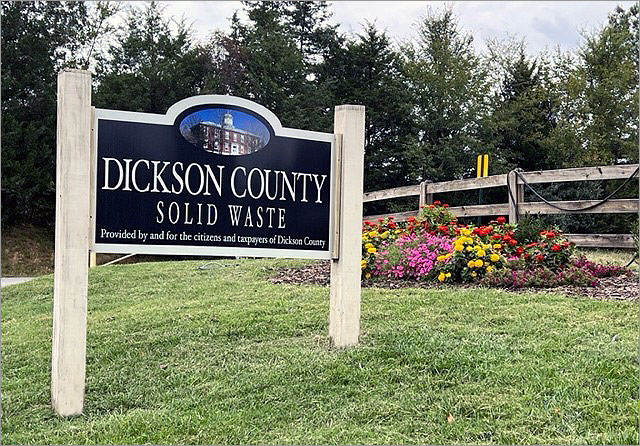 Dickson County Solid Waste Sign with Flowers and Trees in the Background
